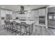 Stylish kitchen boasting a spacious island, white cabinets, and stainless steel appliances at 5927 Villa Loma St, Las Vegas, NV 89148