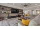 Comfortable living room with stone accent wall, built-in shelving, and modern decor at 5927 Villa Loma St, Las Vegas, NV 89148