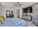 This bedroom features a stylish accent wall, ceiling fan, and a comfortable, well-lit space at 5927 Villa Loma St, Las Vegas, NV 89148