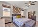 This bedroom features bright natural light, and comfortable bed with stylish décor at 5927 Villa Loma St, Las Vegas, NV 89148