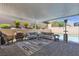 Relax by the pool with this spacious covered patio, complete with an outdoor kitchen and seating at 5927 Villa Loma St, Las Vegas, NV 89148