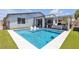 A stunning backyard pool and outdoor seating area for relaxation and enjoyment at 5927 Villa Loma St, Las Vegas, NV 89148