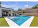 Backyard pool features lounge chairs, covered patio and ample seating at 5927 Villa Loma St, Las Vegas, NV 89148