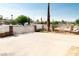 Large driveway secured by a decorative metal fence provides ample parking space at 624 N Bruce St, Las Vegas, NV 89101