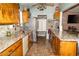 Open kitchen features a spacious layout with granite countertops and a tile backsplash at 624 N Bruce St, Las Vegas, NV 89101