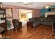 Cozy living room features hardwood floors, brick accent walls, and a comfortable sectional sofa at 624 N Bruce St, Las Vegas, NV 89101