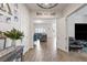 Charming entryway featuring wood-look floors that flow into an open living space at 6421 Winecup St, Las Vegas, NV 89149