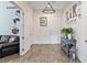 Inviting entryway featuring wood floors, a chandelier, and decoratively adorned walls at 6421 Winecup St, Las Vegas, NV 89149