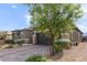 Single-story home featuring desert landscaping, a paver driveway and walkway, and a two car garage at 6421 Winecup St, Las Vegas, NV 89149