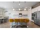 Stylish kitchen featuring pendant lighting, an island with seating, stainless appliances, and lots of cabinet space at 6421 Winecup St, Las Vegas, NV 89149