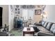 Spacious living room with a bar, sectional sofa, and a Raiders themed decor at 6421 Winecup St, Las Vegas, NV 89149