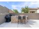 Outdoor kitchen with bar seating and built in grill is great for entertaining friends and Gathering at 6421 Winecup St, Las Vegas, NV 89149