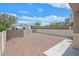 Low-maintenance backyard with gravel groundcover, offering a blank canvas for outdoor living at 6559 Tumbleweed Ridge Ln # 103, Henderson, NV 89011