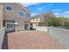 Spacious gravel backyard surrounded by fencing, ensuring privacy and security at 6559 Tumbleweed Ridge Ln # 103, Henderson, NV 89011