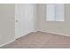 Bedroom features a window, closet, and carpet at 6559 Tumbleweed Ridge Ln # 103, Henderson, NV 89011
