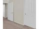 Bedroom features multiple doors leading to other parts of the home at 6559 Tumbleweed Ridge Ln # 103, Henderson, NV 89011