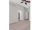 Bedroom boasts a vaulted ceiling, ceiling fan, carpet, and multiple entrances to other rooms at 6559 Tumbleweed Ridge Ln # 103, Henderson, NV 89011