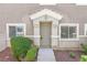 Charming home entrance with a well-manicured front yard, covered porch, and inviting curb appeal at 6559 Tumbleweed Ridge Ln # 103, Henderson, NV 89011