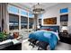 Bright bedroom with large windows offering city views, complemented by stylish decor and furnishings at 658 Agate Bridge St, Las Vegas, NV 89138