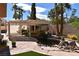 Tranquil backyard pond with rock features and mature trees provides a serene outdoor space at 7250 Birkland Ct, Las Vegas, NV 89117