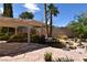 Lush backyard features a rock pond, mature trees, and stone tile providing a serene outdoor space at 7250 Birkland Ct, Las Vegas, NV 89117