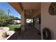 Comfortable covered patio with ceiling fans connects to a gazebo and mature landscaping for a relaxing outdoor space at 7250 Birkland Ct, Las Vegas, NV 89117