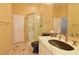 Modern bathroom features a glass shower, marble countertop, and dark accents at 7250 Birkland Ct, Las Vegas, NV 89117