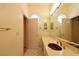 Bathroom with a long marble countertop, a large mirror, and white tile floor at 7250 Birkland Ct, Las Vegas, NV 89117