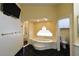 Elegant bathroom with a soaking tub, a separate shower, and a toilet room at 7250 Birkland Ct, Las Vegas, NV 89117