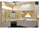 Elegant bathroom featuring dual sinks, ample counter space, and modern lighting fixtures at 7250 Birkland Ct, Las Vegas, NV 89117
