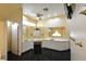 Bathroom featuring marble countertops, dual vanities, and modern fixtures at 7250 Birkland Ct, Las Vegas, NV 89117