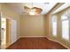 Bedroom with hardwood floors, bay window with shutters, and ceiling fan at 7250 Birkland Ct, Las Vegas, NV 89117