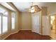 Bedroom featuring hardwood floors, a ceiling fan, and shuttered windows at 7250 Birkland Ct, Las Vegas, NV 89117