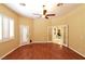 Bright bedroom with wood flooring, ceiling fan and access to another room at 7250 Birkland Ct, Las Vegas, NV 89117