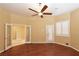 Expansive bedroom with hardwood floors, natural light, and access to an outdoor space at 7250 Birkland Ct, Las Vegas, NV 89117