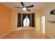 Bedroom with hardwood floors, brown curtains, and large windows allowing natural light at 7250 Birkland Ct, Las Vegas, NV 89117