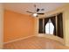 Bright bedroom with hardwood floors, a ceiling fan, and a window with curtains at 7250 Birkland Ct, Las Vegas, NV 89117