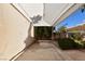 Covered carport providing parking with shade, complemented by lush landscaping and a clear blue sky at 7250 Birkland Ct, Las Vegas, NV 89117