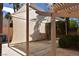 Spacious carport featuring a protective covering, integrated into a landscaped backyard with trees at 7250 Birkland Ct, Las Vegas, NV 89117