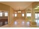 Open dining room featuring tile flooring, designer lighting, and an open floorplan to the kitchen at 7250 Birkland Ct, Las Vegas, NV 89117