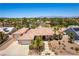 Stunning single-story home featuring a tile roof, desert landscaping, and a three-car garage at 7250 Birkland Ct, Las Vegas, NV 89117