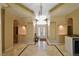 Grand foyer featuring tiled floors, high ceilings, and elegant lighting fixtures at 7250 Birkland Ct, Las Vegas, NV 89117