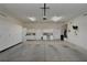Large garage with multiple storage cabinets and access doors for convenience and organization at 7250 Birkland Ct, Las Vegas, NV 89117