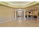 Open floorplan showcasing tiled floors, pillars, and a view into the entryway at 7250 Birkland Ct, Las Vegas, NV 89117