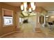Large living space with travertine floors, fireplace, expansive windows, and open floor plan at 7250 Birkland Ct, Las Vegas, NV 89117