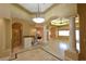 Open-concept living area with tile flooring, pillars, and recessed lighting at 7250 Birkland Ct, Las Vegas, NV 89117