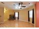 Expansive living room features a modern fireplace, neutral walls, wood floors, and bright windows at 7250 Birkland Ct, Las Vegas, NV 89117