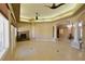 Large living space with travertine floors, fireplace, expansive windows, and archway to front entrance at 7250 Birkland Ct, Las Vegas, NV 89117