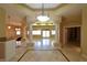 Spacious living room with tiled floors, pillars, and ample natural light at 7250 Birkland Ct, Las Vegas, NV 89117