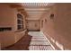Covered patio featuring tiled flooring, wall decor, and outdoor lighting at 7250 Birkland Ct, Las Vegas, NV 89117